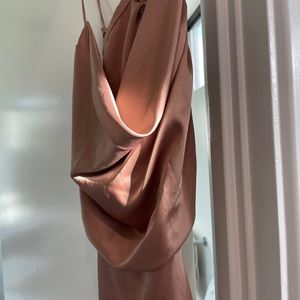 Silk dress is blush pink.